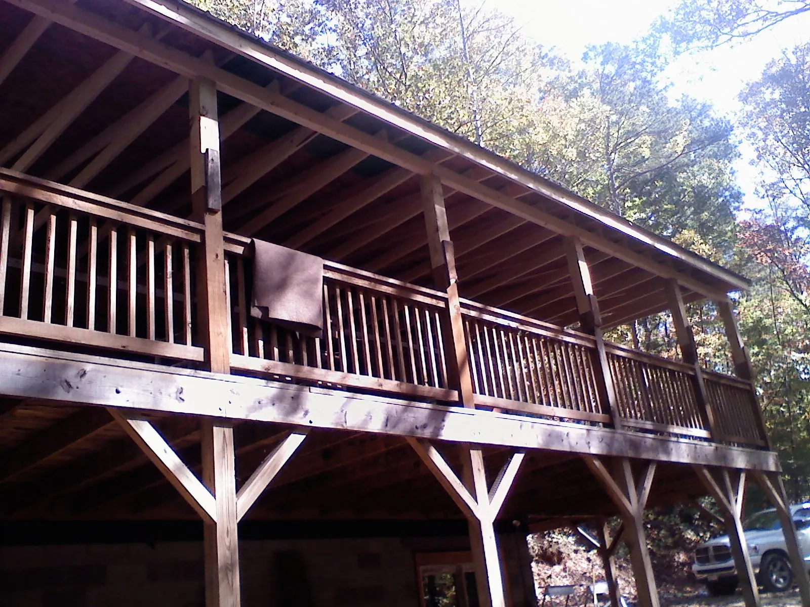 Timber framing under a new elevated porch and deck — Roof Leak Repair in Berthoud by Roofing Brothers